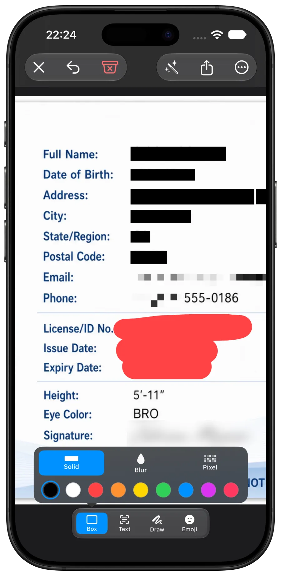 The Redacted iPhone app covering fields on an ID card with black boxes, pixelation, and a red scribble, with the solid mask color picker open.